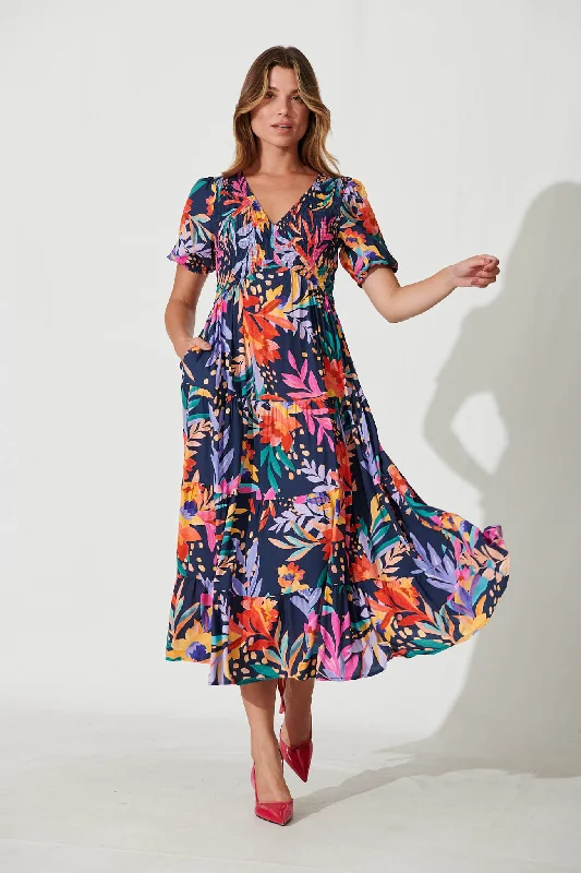 Maxi dresses with bow accents at the waist for a sweet appearanceKami Maxi Dress In Navy With Bright Leaf Print